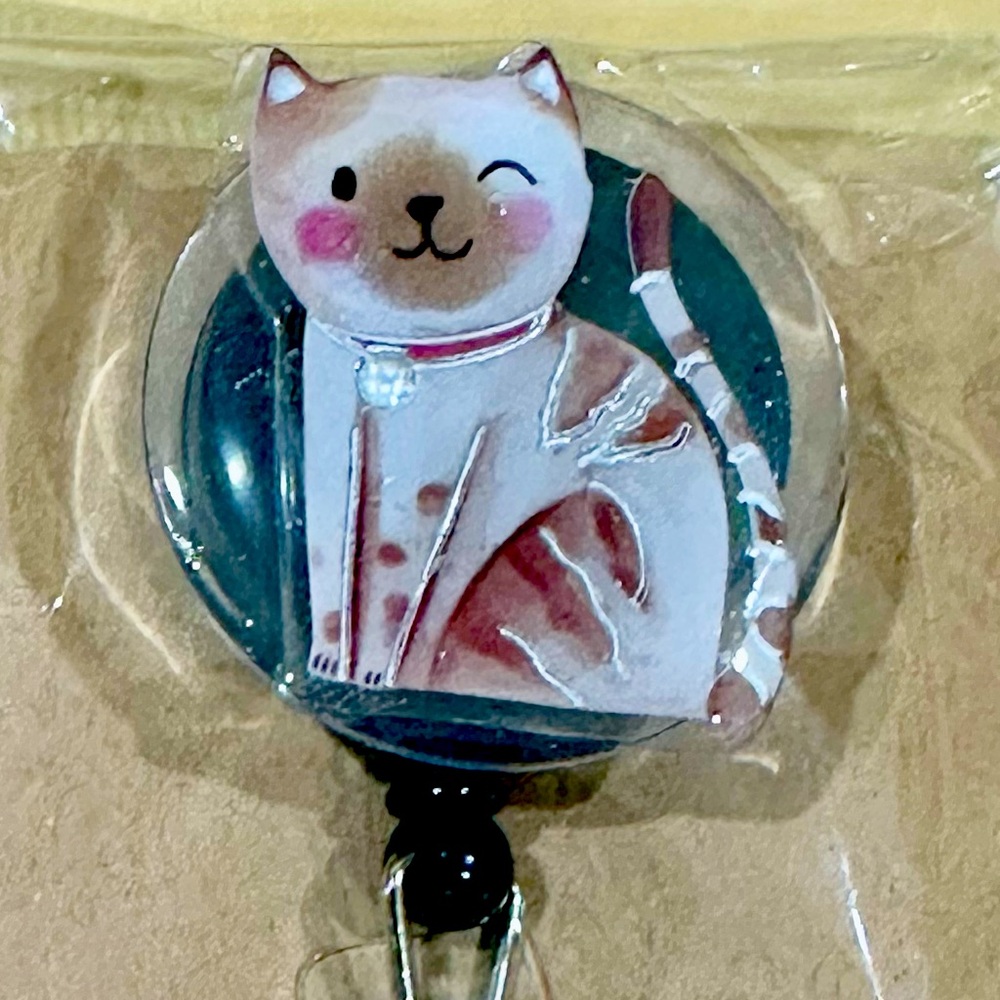 Winky cat badge reel with belt clip